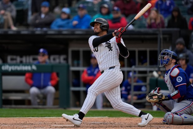 White Sox second baseman Lenyn Sosa hits a three-run double during the sixth inning against the Rangers on May 24, 2025, at Rate Field. (Erin Hooley/AP)