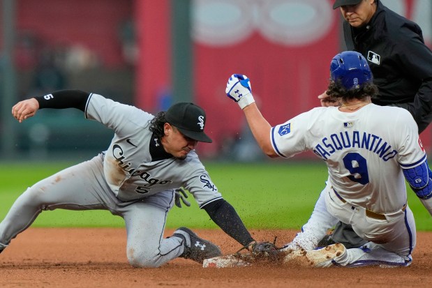 Kansas City Royals' Vinnie Pasquantino (9) is tagged out at second by Chicago White Sox second baseman Josh Rojas (5) after trying to reach on a his single during the fourth inning of a baseball game, Tuesday, May 6, 2025, in Kansas City, Mo. (AP Photo/Charlie Riedel)