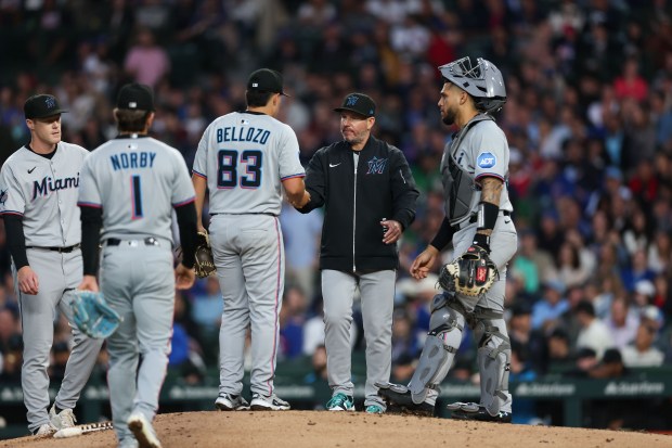 Miami Marlins manager Clayton McCullough takes out Miami Marlins pitcher Valente Bellozo (83) during the fifth inning against the Chicago Cubs at Wrigley Field Tuesday May 13, 2025, in Chicago. (Armando L. Sanchez/Chicago Tribune)