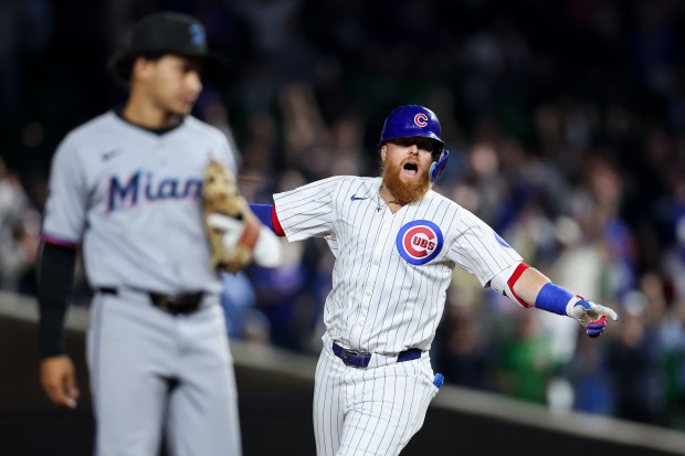Chicago Cubs pinch hitter Justin Turner (3) celebrates after hitting a walk-off two RBI double to give the Cubs a 5-4 win over the Miami Marlins at Wrigley Field Tuesday May 13, 2025, in Chicago. (Armando L. Sanchez/Chicago Tribune)