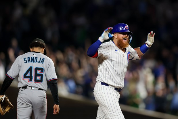 Chicago Cubs pinch hitter Justin Turner (3) celebrates after hitting a walk-off two RBI double to give the Cubs a 5-4 win over the Miami Marlins at Wrigley Field Tuesday May 13, 2025, in Chicago. (Armando L. Sanchez/Chicago Tribune)
