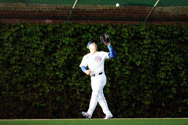 Chicago Cubs outfielder Seiya Suzuki (27) catches a fly-out from Miami Marlins outfielder Jesús Sánchez (7) during the first inning at Wrigley Field Tuesday May 13, 2025, in Chicago. (Armando L. Sanchez/Chicago Tribune)