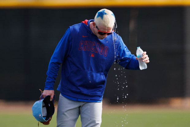 Chicago Cubs outfielder Pete Crow-Armstrong pours water on his head on the first day of full-squad workouts during spring training at Sloan Park Friday Feb. 14, 2025, in Mesa, Ariz. (Armando L. Sanchez/Chicago Tribune)