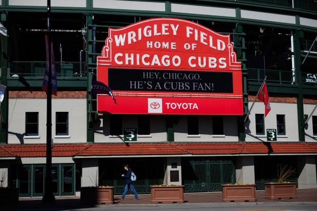 "Hey, Chicago. He's a Cubs fan!" sits on the Wrigley Field marquee after Cardinal Robert Prevost, a Chicago native, was chosen as the 267th pontiff of the Roman Catholic Church, choosing the name of Pope Leo XIV Thursday May 8, 2025, in Chicago. (Armando L. Sanchez/Chicago Tribune)