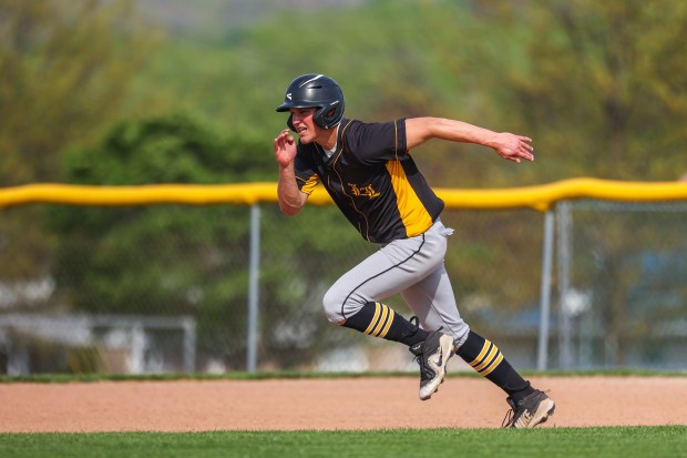 Lake-Lehman's Chris Sholtis attempts to steal second base during a WVC Division 2 baseball game on Tuesday, April 29, 2025. (JASON ARDAN / STAFF PHOTOGRAPHER)