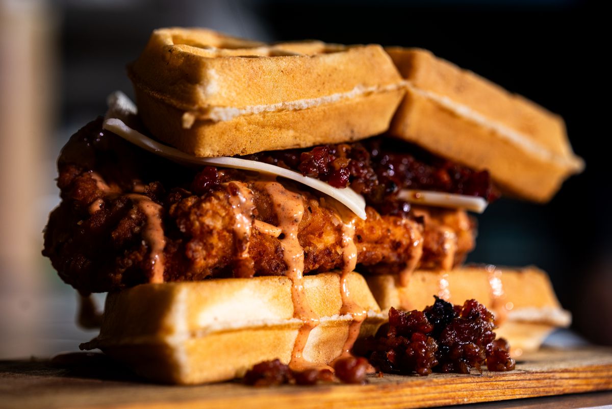 A fried chicken and waffle sandwich.