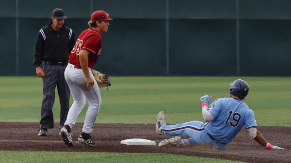 freshman 1stbaser Dylan Mares slides to second base plate