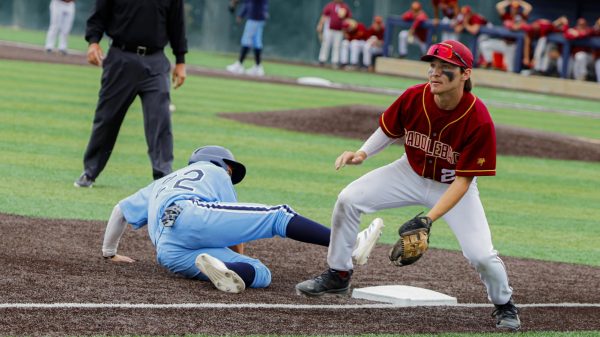 El Camino College Warriors Aden Laureano slides base clearing slide to third base in the 6th inning.