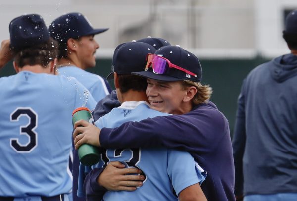 El Camino College Warriors right hand pitcher freshman Henry Sorman embraces his teammate after their 7-4 victory against the Saddleback College Bobcats on Saturday, May 3 in the ECC baseball field. (Oriana de Quay | the Union)