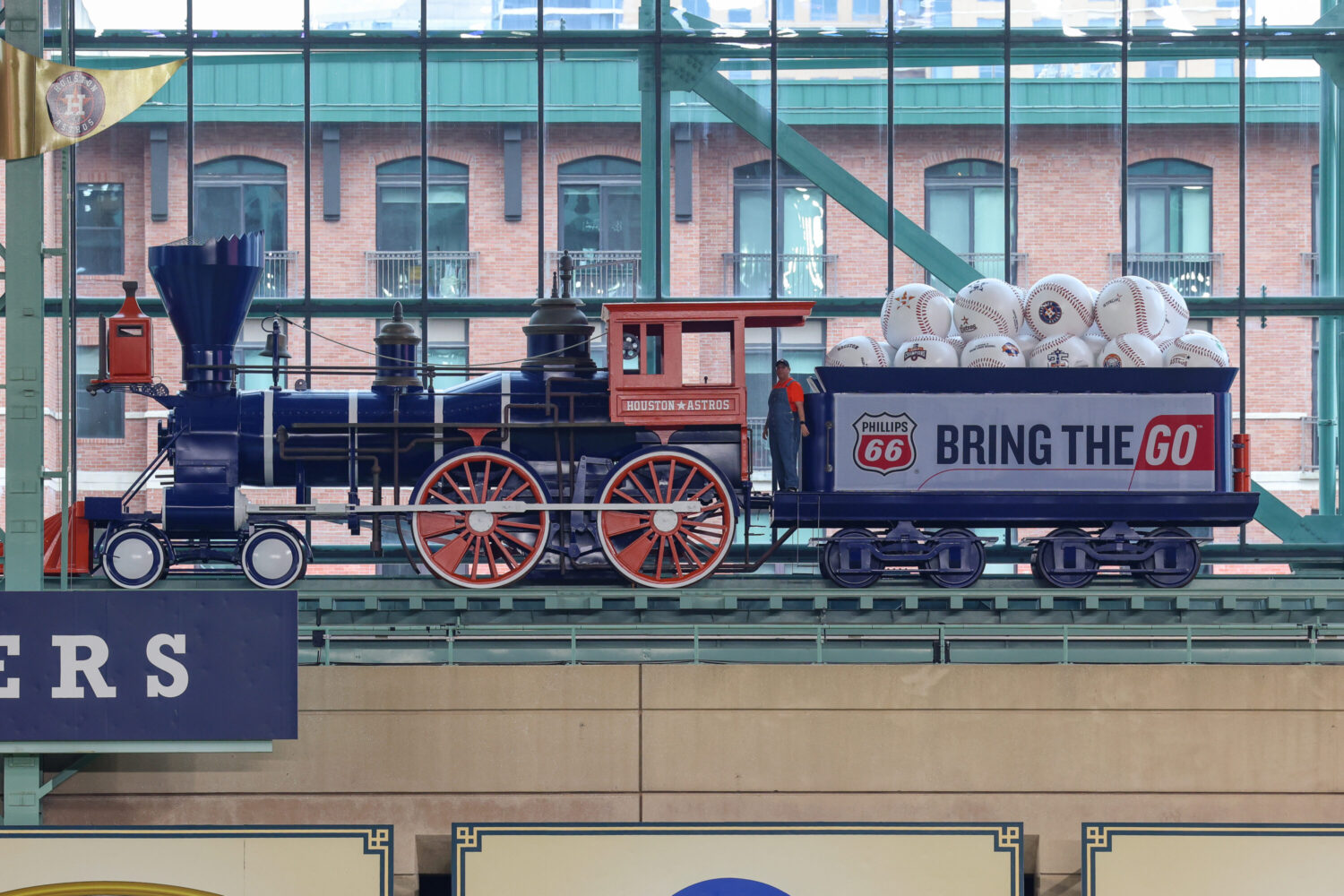 Houston Astros train cargo unveiled as oranges are gone and baseballs fill refreshed locomotive at Daikin Park – Houston Public Media
