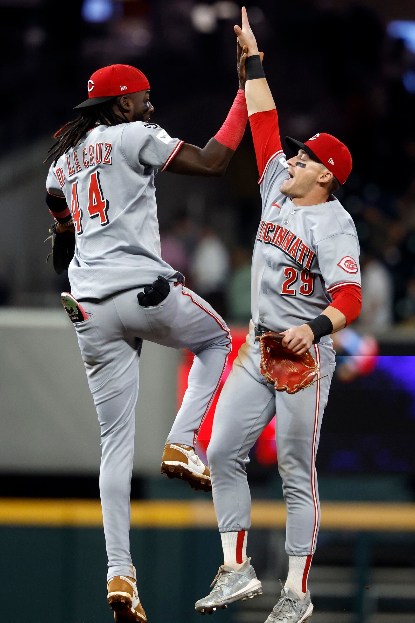 Cincinnati Reds' Elly De La Cruz (44) and TJ Friedl (29) celebrate after a win over the Atlanta Braves during the ninth inning of a baseball game, Wednesday, May 7, 2025, in Atlanta. (AP Photo/Butch Dill)