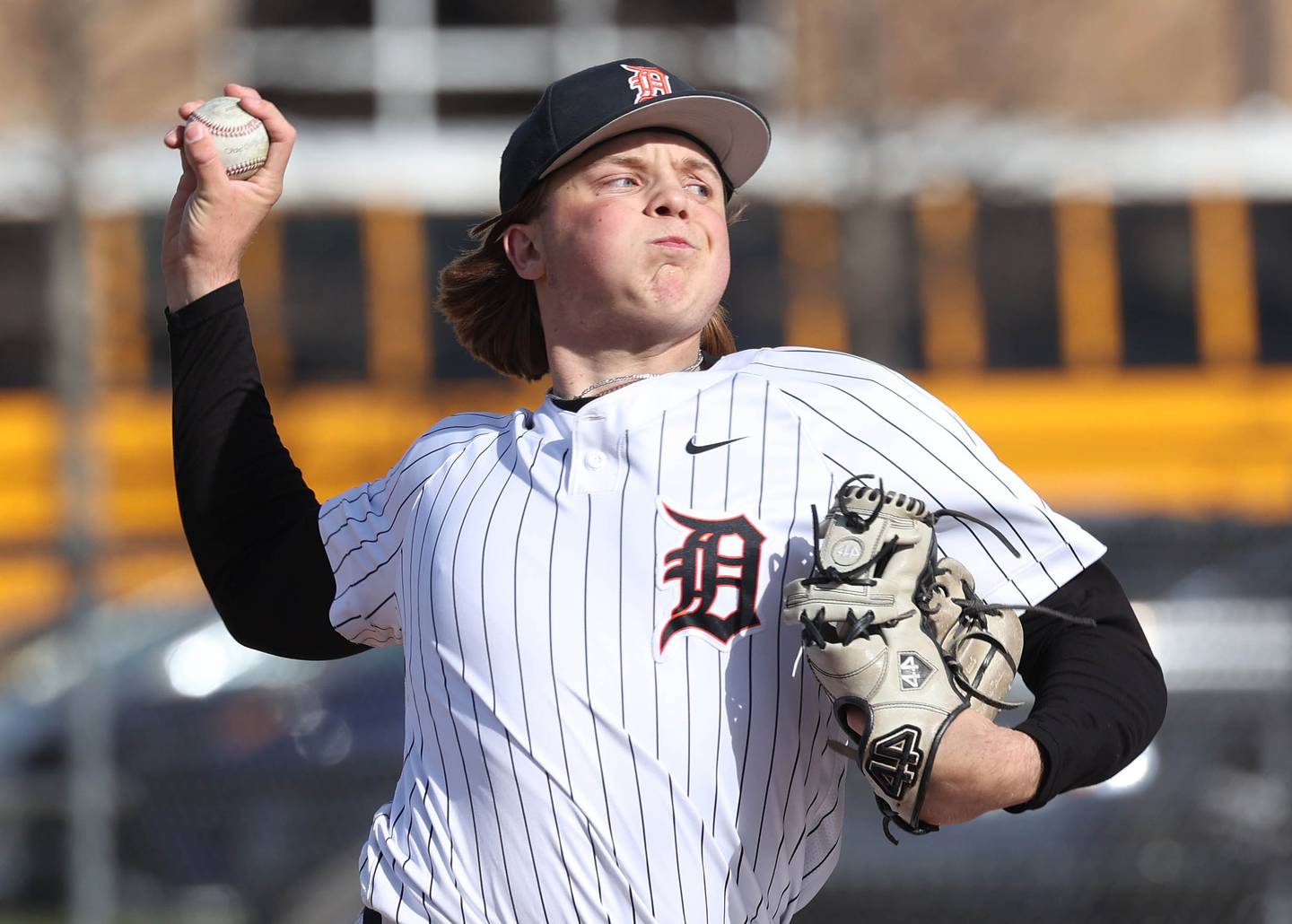 DeKalb's Brodie Farrell delivers a pitch Tuesday, April 15, 2025, during their game against Naperville North at DeKalb High School.