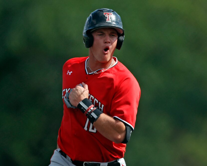 Texas Tech's Josh Jung (16) cheers after Cameron Warren (11) hit a home run against Dallas...