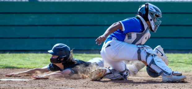 Grand Terrace’s Troy Calderon #8 scores ahead of the tag...