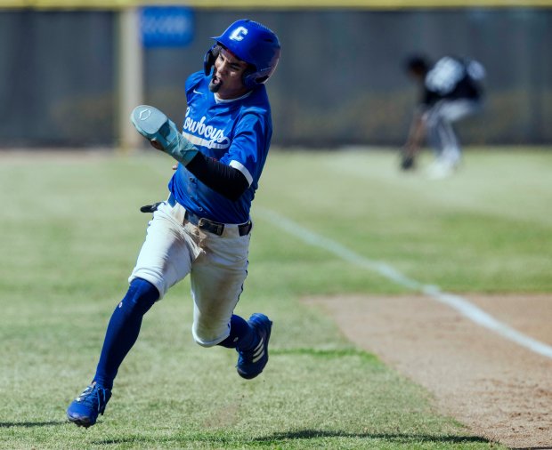 Chino’s Xiovany Ochoa #6 rounds third and scores on a...