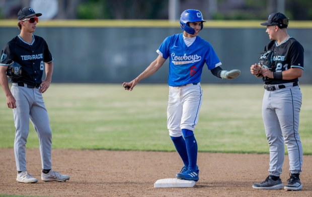 Chino’s Xiovany Ochoa #6 talks with Grand Terrace’s Vann Morris...