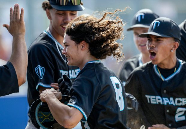 Grand Terrace’s Troy Calderon #8 celebrates after scoring against Chino...