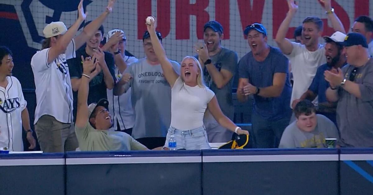 Rays fan catches homerun ball in their hat on a fun Memorial Day