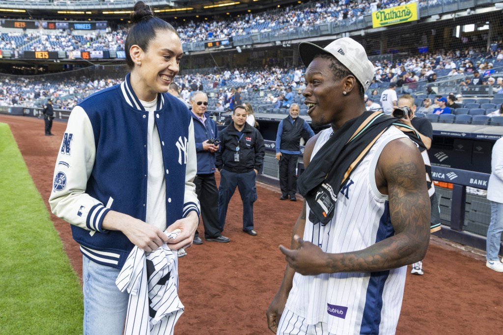 Jazz Chisholm talks with Liberty Star Breanna Stewart who threw out the pitch before the Yankees' win over the Mets on May 18, 2025.