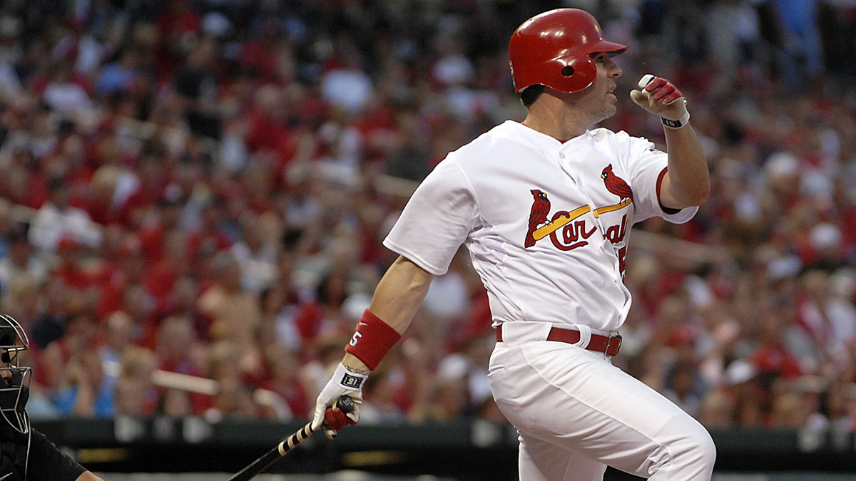 St. Louis Cardinals outfielder Jim Edmonds (15) singles against the Colorado Rockies at Busch Stadium in St. Louis, MO. Edmonds went 3 for 4 as the Cardinals defeated the Rockies 4-1.