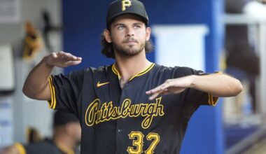 Pittsburgh Pirates starting pitcher Jared Jones warms up in the dugout during the fourth inning of a baseball game against the Miami Marlins, Saturday, March 30, 2024, in Miami. (AP Photo/Wilfredo Lee)