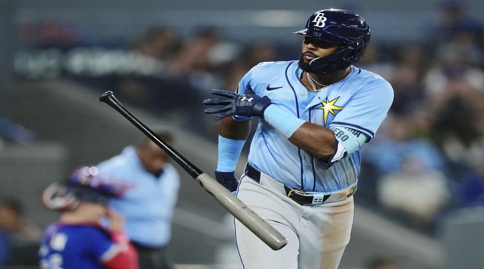 Tampa Bay Rays' Junior Caminero (13) celebrates his grand slam against the Toronto Blue Jays during ninth inning MLB baseball action in Toronto on Tuesday, May 13, 2025. (Nathan Denette/The Canadian Press via AP)