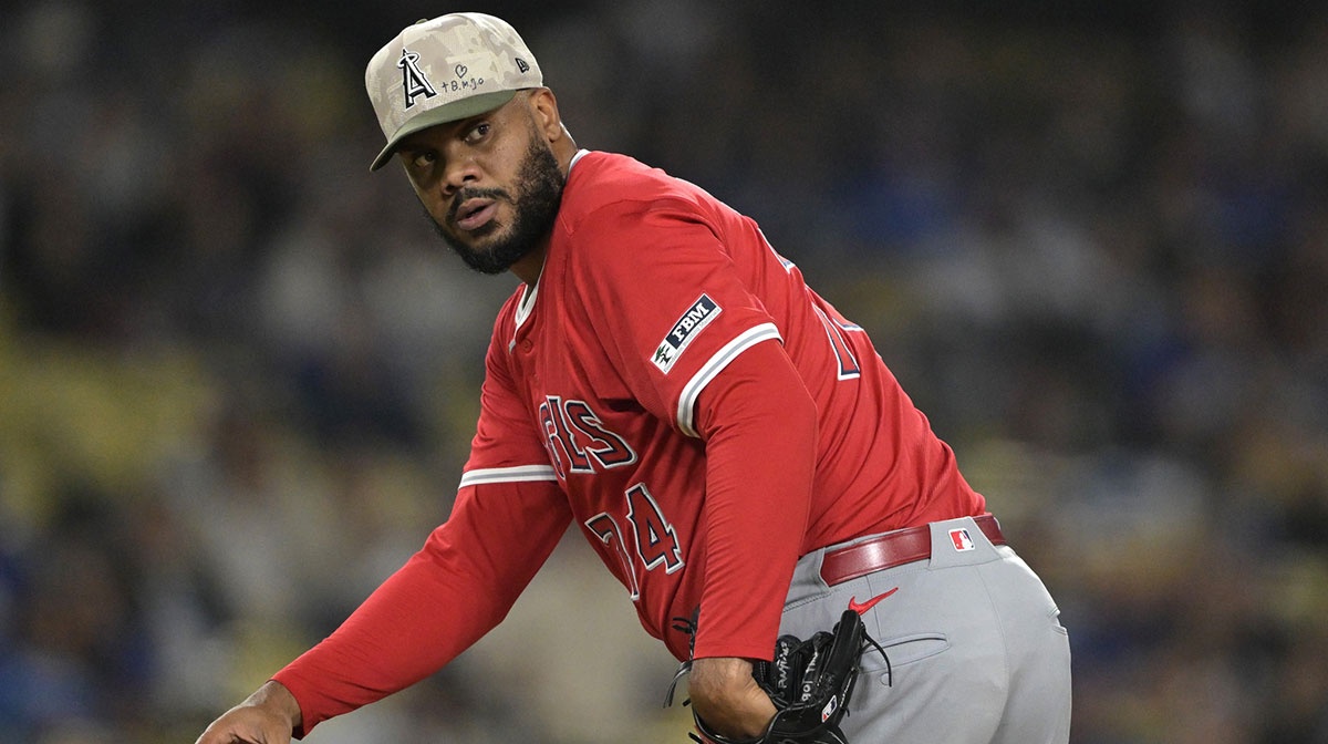 Los Angeles Angels relief pitcher Kenley Jansen (74) checks the runner at first in the ninth inning against the Los Angeles Dodgers at Dodger Stadium.