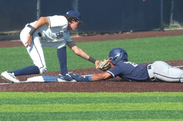 St. John Bosco third baseman Jack Champlin tags out Vista...