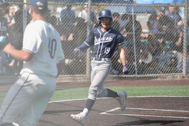 Vista Murrieta’s Gavin Kramer scores a run in the second...
