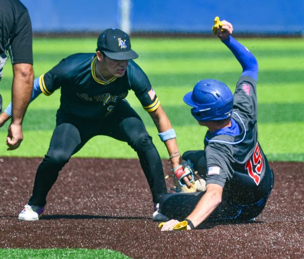 La Mirada shortstop Aiden Aguayo (22) tags Los Alamitos’ Rowan...