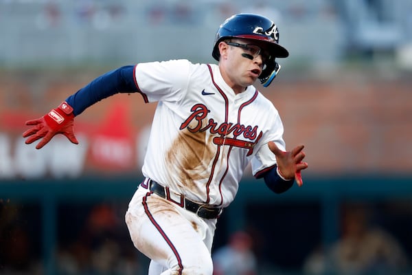 Braves outfielder Alex Verdugo rounds third to score after a double by Austin Riley during the third inning against the Cincinnati Reds on Monday in Atlanta. The Braves signed Verdugo just before the season as a minor investment to improve their depth. (Butch Dill/AP)