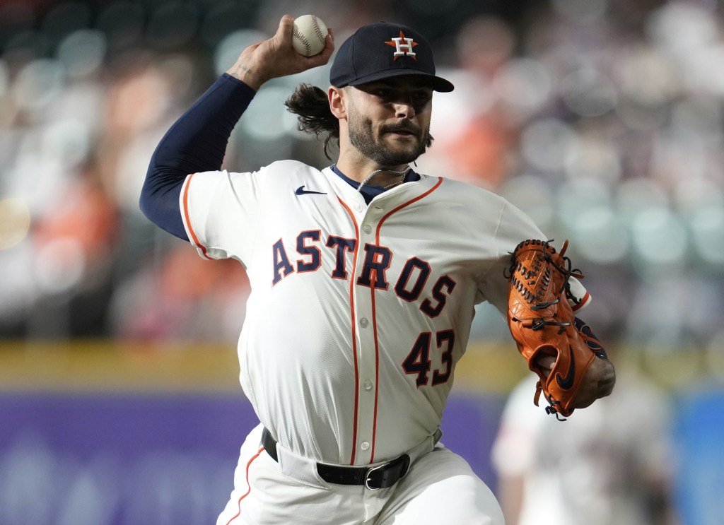 Lance McCullers throws a pitch during the first inning of the Astros' loss to the Reds. 