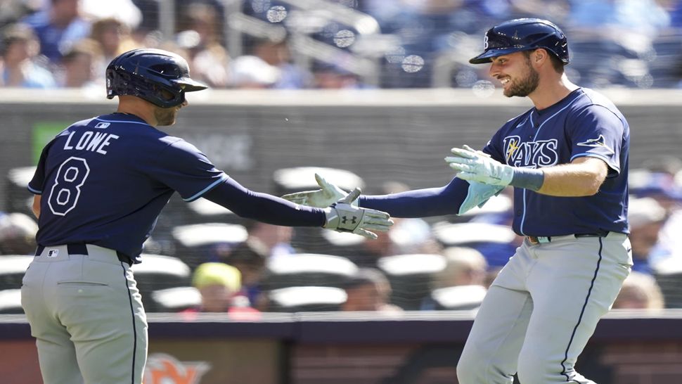 Tampa Bay designated hitter Josh Lowe celebrates his solo home run with teammate Brandon Lowe during the fifth inning on Thursday.