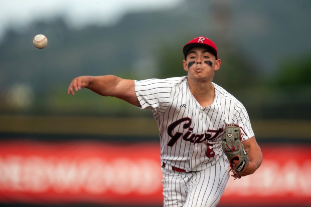Redwood pitcher Matthew Knauer (6) delivers against San Rafael during...