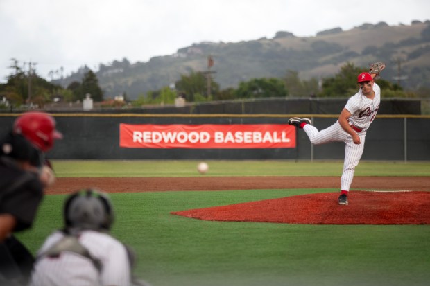 Redwood pitcher Matthew Knauer (6) delivers against San Rafael during...
