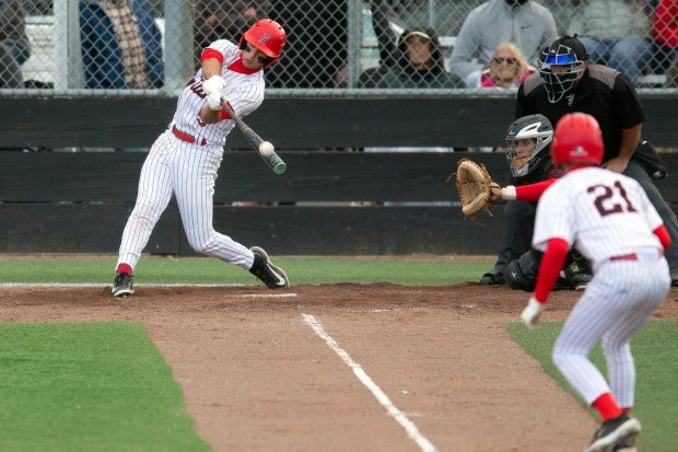 Redwood’s Sam Gersch (5) connects for a sacrifice fly against...