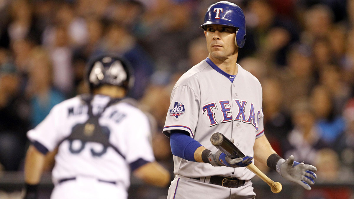 Texas Rangers designated hitter Michael Young (10) walks back to the dugout after striking out against the Seattle Mariners during the eighth inning at Safeco Field.