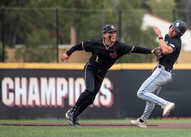 JSerra second baseman Cole Strane tags Santa Margarita runner Gavin Spiridonoff as he's caught in a pickle while trying to steal a base during a Trinity League game between the two teams on Wednesday, April 23, 2025. (Photo by Jeff Antenore, Contributing Photographer)