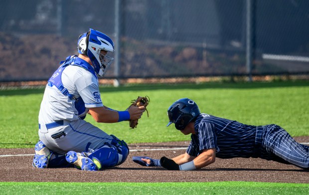 Santa Margarita catcher Warren Gravely IV tags out Newport Harbor’s...