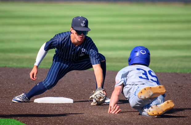 Newport Harbor second baseman Grant Horsley waits to tag out...