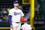 Texas Rangers relief pitcher Shawn Armstrong (43) reacts after giving up a grand slam to...