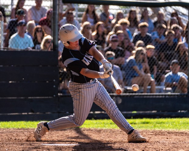 Pleasant Valley's Colton Fleck doubles to right field in the...