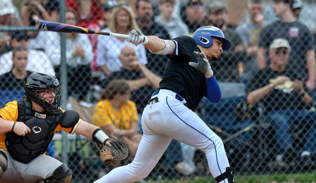 Boone Grove's Davian Carrera hits the ball 