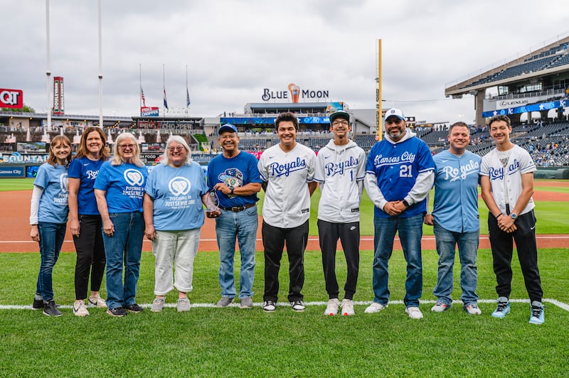 Director of the Westside Community Action Network Center, Jorge Coromac — fifth from the left — is honored with the Kansas City JustServe “Nonprofit of the Year” award at the Kansas City Royals Major League Baseball game as part of a JustServe night April 25, 2025, in Kansas City, Missouri.