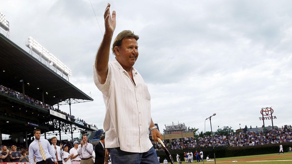 Chicago Cubs former third baseman Ron Santo waves to the crowd as he is honored for 50 years of service with the organization before the game against the Pittsburgh Pirates at Wrigley Field. 