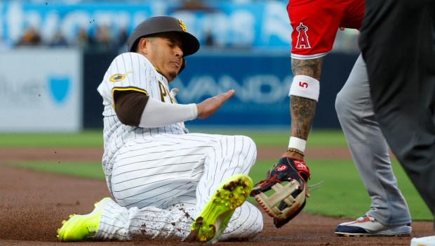 San Diego Padres' Manny Machado slides safely into third base on a Jackson Merrill double in the first inning at Petco Park on Monday, May 12, 2025. (K.C. Alfred / The San Diego Union-Tribune)