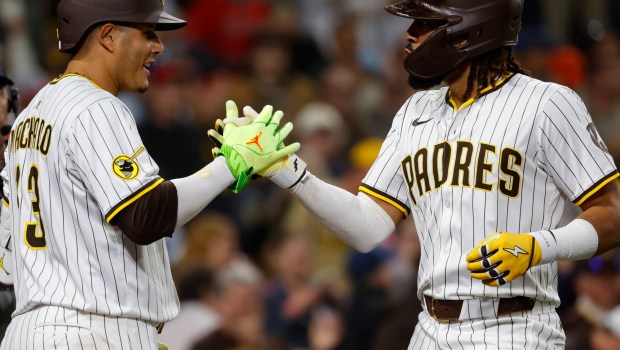 San Diego Padres' Fernando Tatis Jr. celebrates with Manny Machado after hitting a solo home run in the fifth inning against the Los Angeles Angels at Petco Park on Monday, May 12, 2025. (K.C. Alfred / The San Diego Union-Tribune)