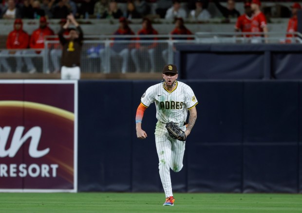 San Diego Padres' Jackson Merrill celebrates making a diving catch on a hit by Los Angeles Angels' Nolan Schanuel in the seventh inning at Petco Park on Monday, May 12, 2025. (K.C. Alfred / The San Diego Union-Tribune)