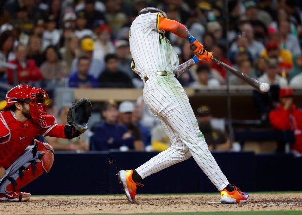 San Diego Padres' Jackson Merrill hits a triple in the eighth inning against the Los Angeles Angels at Petco Park on Monday, May 12, 2025. (K.C. Alfred / The San Diego Union-Tribune)