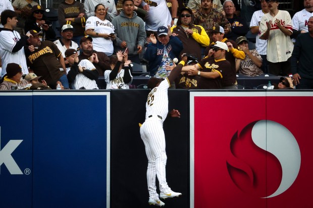 San Diego Padres left fielder Jason Heyward attempts to catch Los Angeles Angels shortstop Zach Neto's home run ball during the first inning at Petco Park on Tuesday, May 13, 2025 in San Diego, CA. (Meg McLaughlin / The San Diego Union-Tribune)